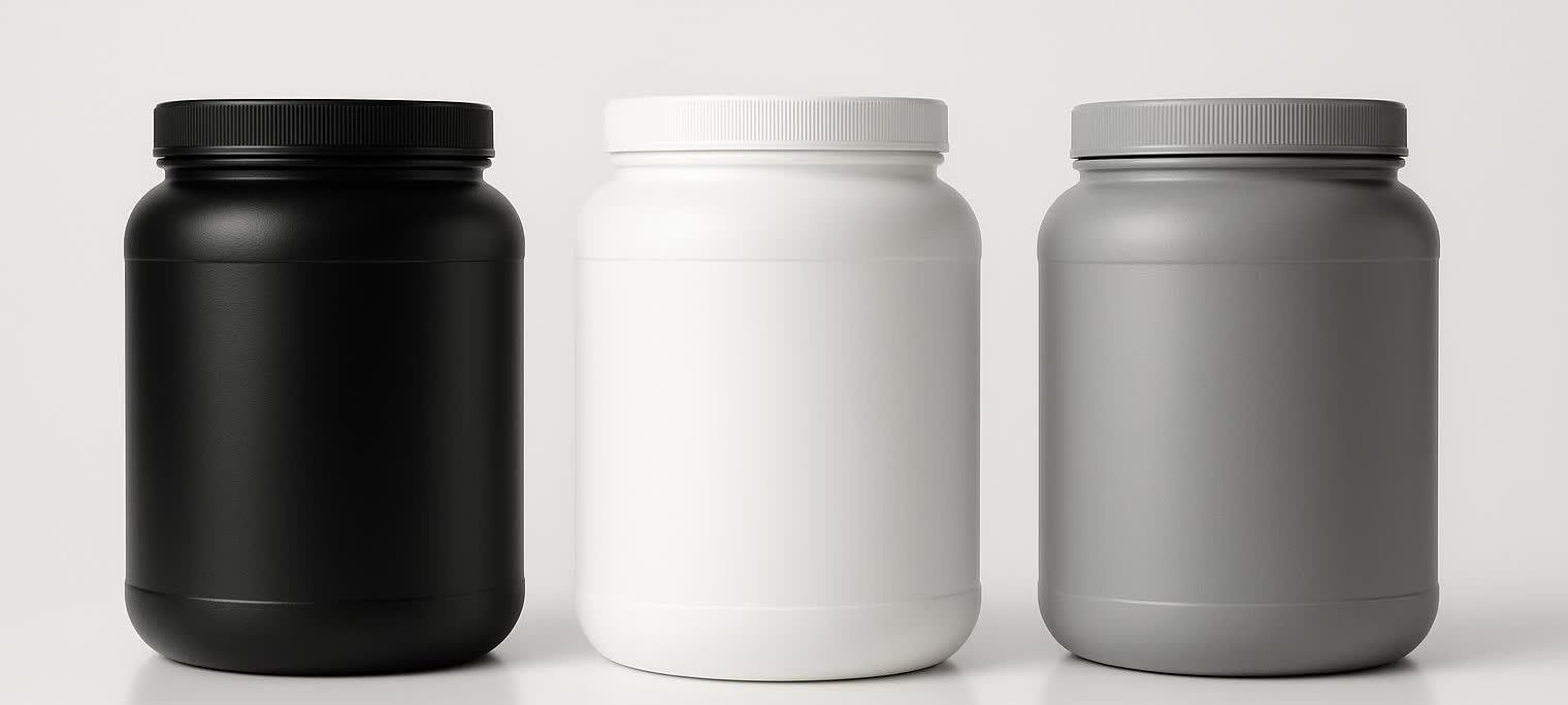 Three minimalist, unbranded pre-workout tubs are lined up in a row. From left to right, the tubs are black, white, and a light gray, featuring matching black, white, and gray lids respectively. They are set against a plain light background.