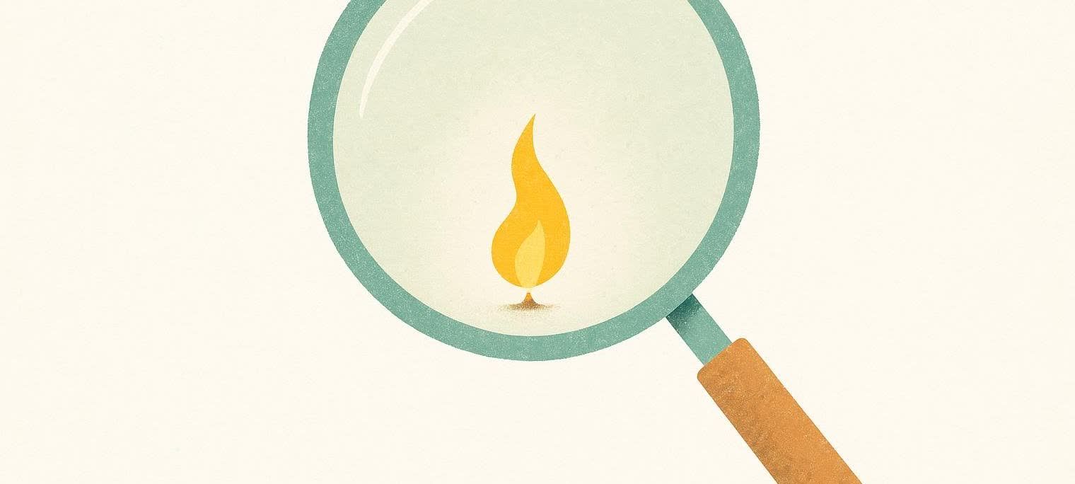 An abstract illustration of a magnifying glass closely examining a tiny flame, symbolizing a minuscule amount of energy.