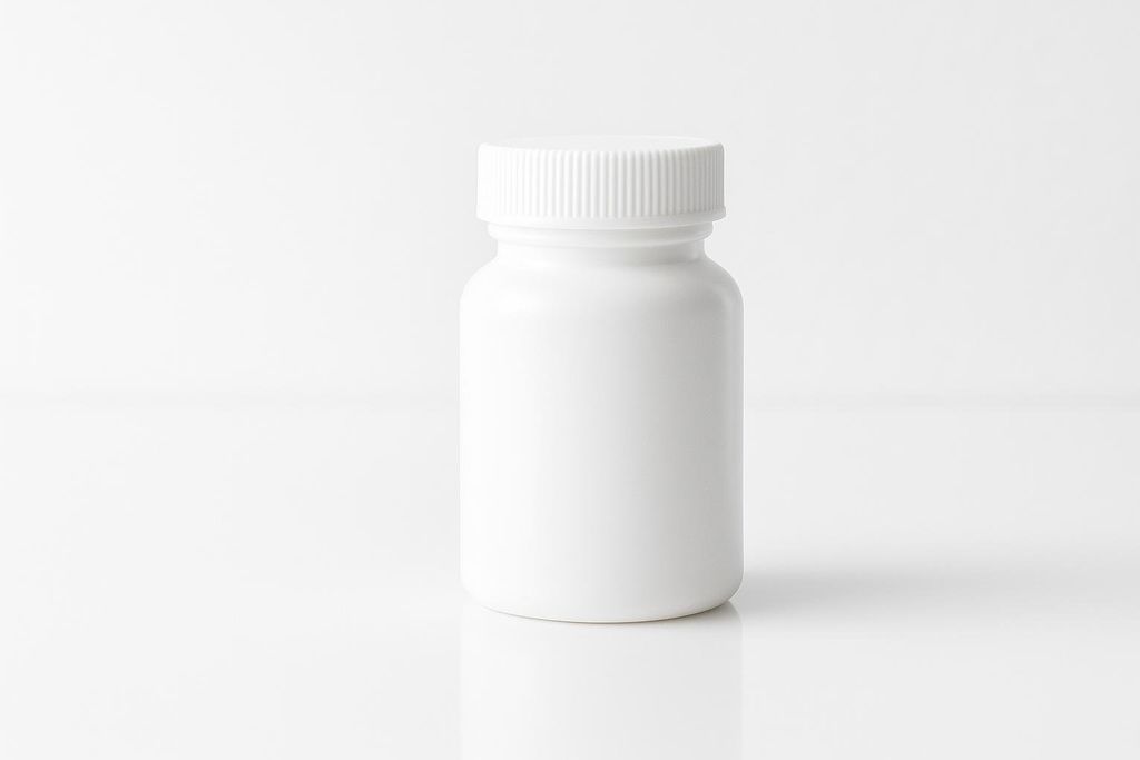A generic, solid white prescription pill bottle with a textured white cap, standing upright on a minimalist white surface with a subtle reflection. The background is also white, creating a clean, high-key image.