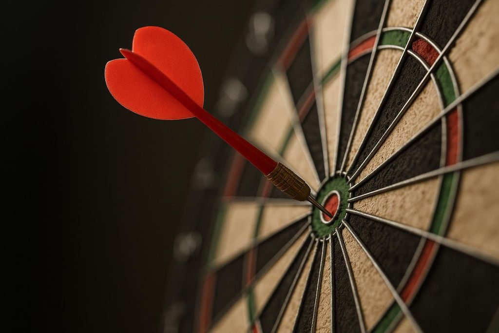 A close-up shot of a red dart expertly hitting the bullseye of a dartboard, symbolizing precision and accuracy, particularly in contrast to home scales.