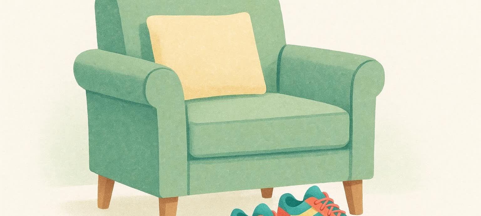 An illustration depicting a light green armchair with a yellow pillow, and a pair of colorful sneakers sitting on the floor in front of it. The background is a plain off-white color.