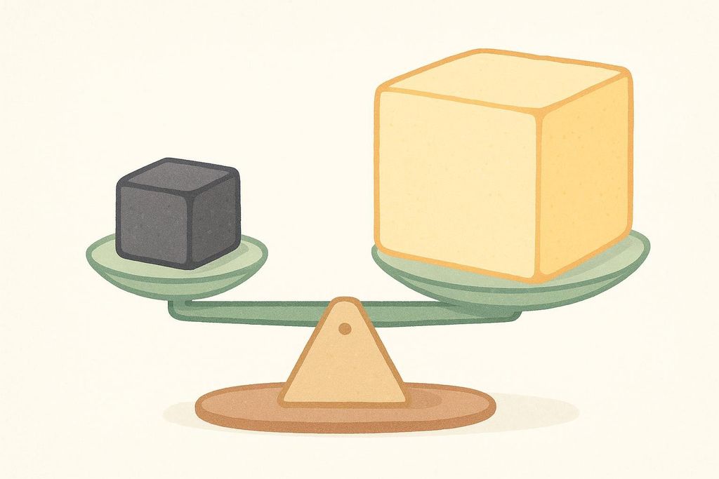 An illustration depicting the difference in density between muscle and fat. A small, dark gray cube representing muscle is shown on one side of a scale, while a larger, yellow cube representing fat is on the other. Both sides of the scale are level, indicating muscle is denser than fat by showing less volume for the same mass.